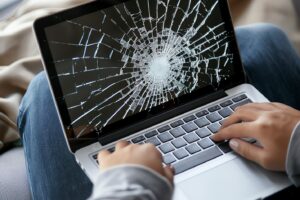 person-with-broken-laptop-claiming-device-insurance