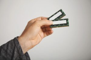 two-ram-chips-man-s-hand-isolated-white